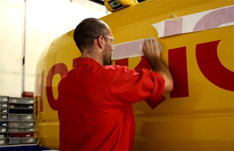 AIS employee applying decal